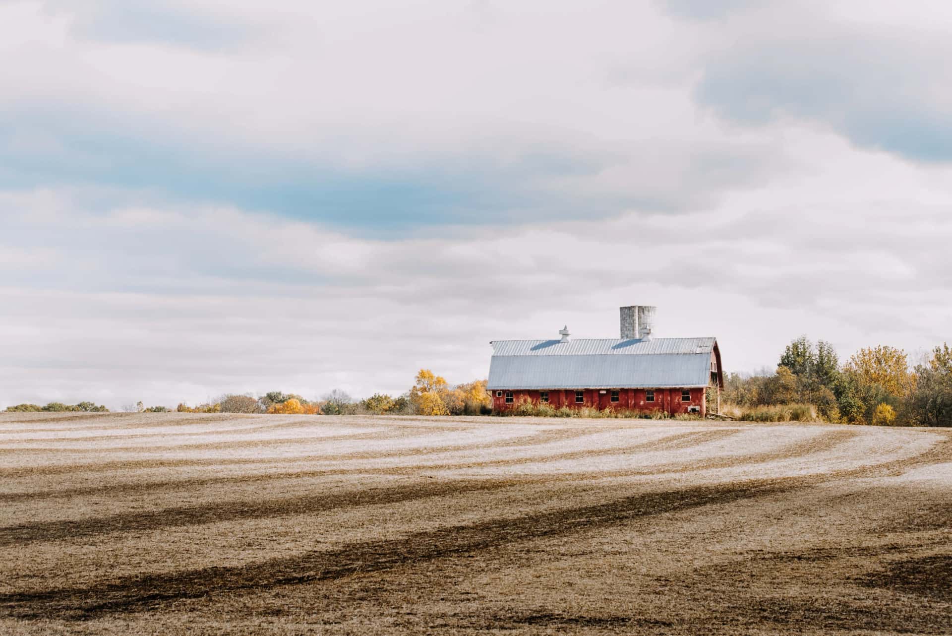Modern American farm standing strong after ag loan under clear sky